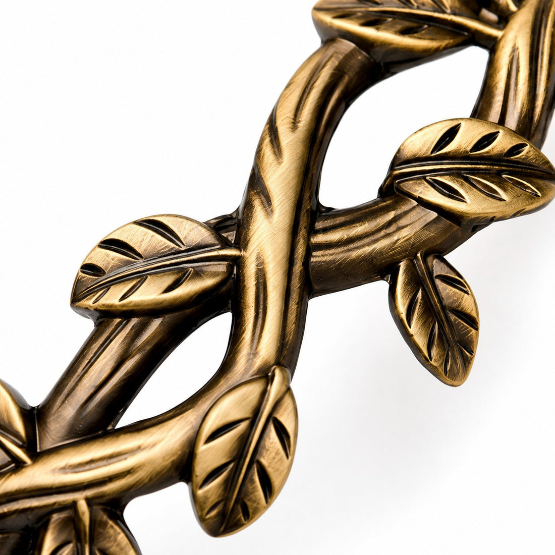 Antique brass leaf detail on the cabinet pull