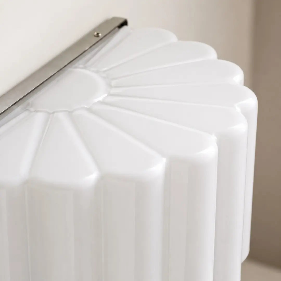 Top detail of the pleated white glass shade