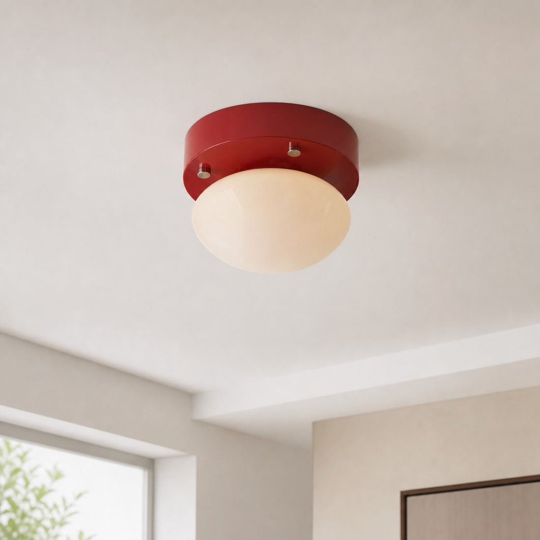 Red glass LED ceiling light installed in a compact neutral interior
