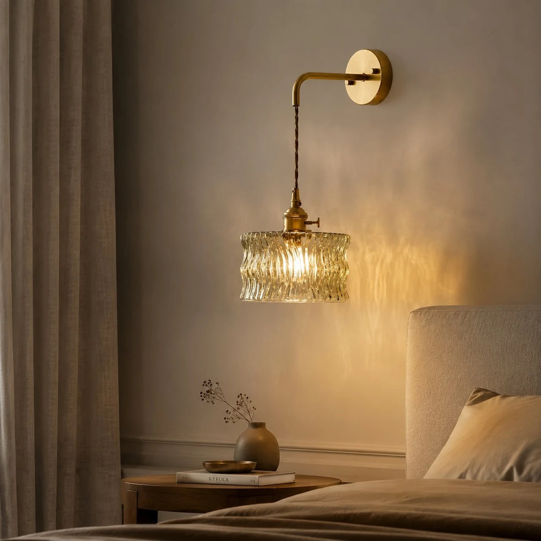 Chain-hung ripple glass wall light in a bedroom