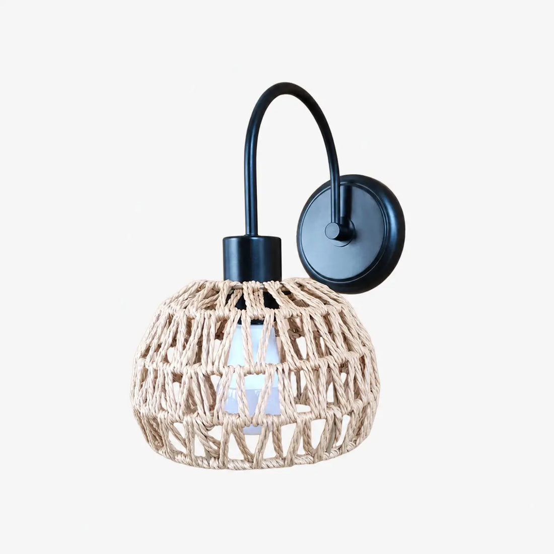 Shade A woven rattan wall sconce in matte black
