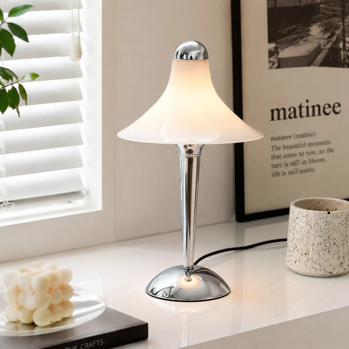 White table lamp beside a window