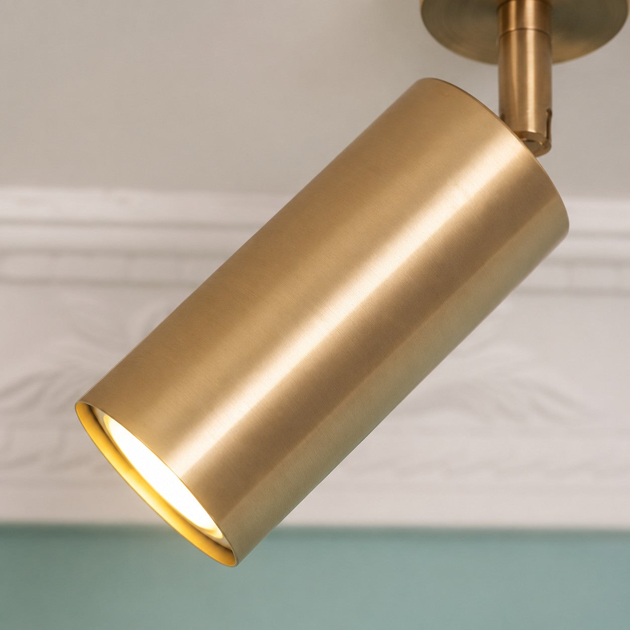 Brushed brass cylindrical spotlight shade detail