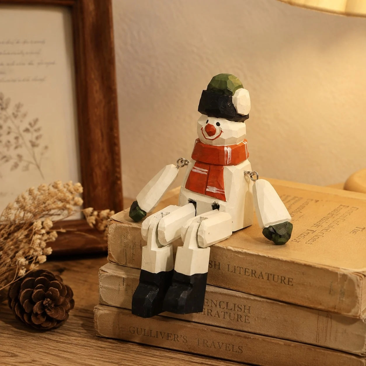 Hand-carved wooden santa snowman ornament styled on a tabletop edge