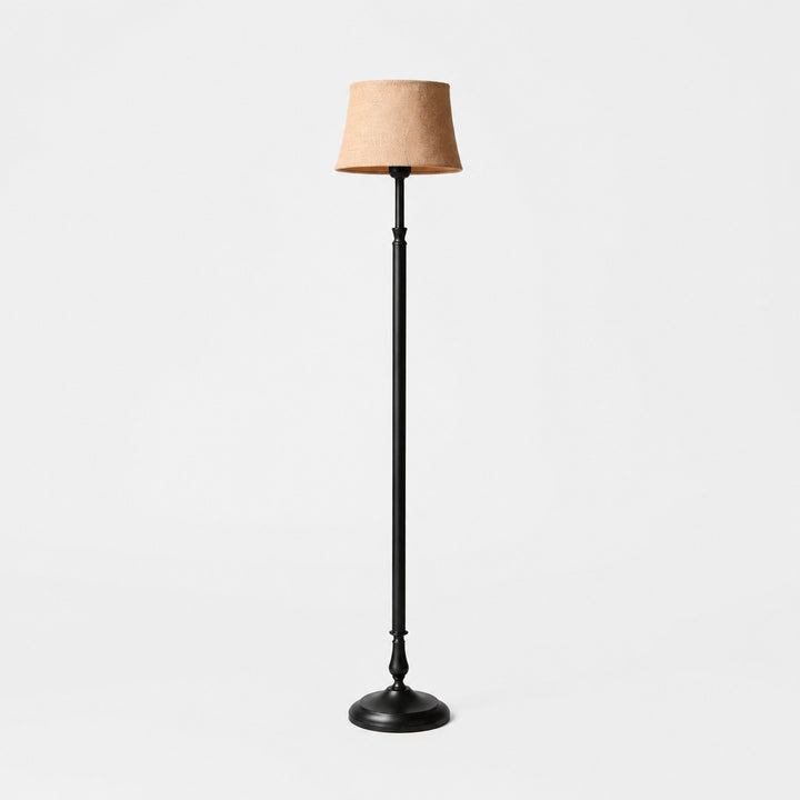 Vintage black iron floor lamp with natural linen shade