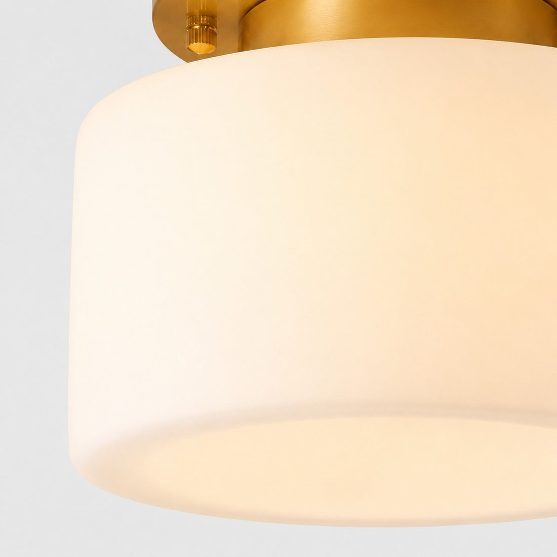 Close detail of glowing cylindrical glass shade