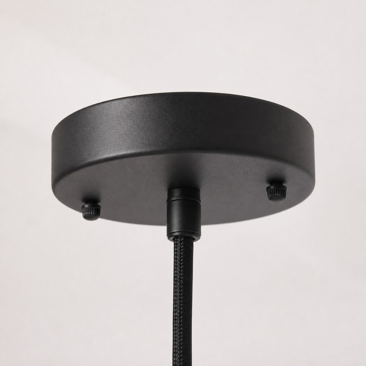 Black ceiling canopy detail for wooden pendant light