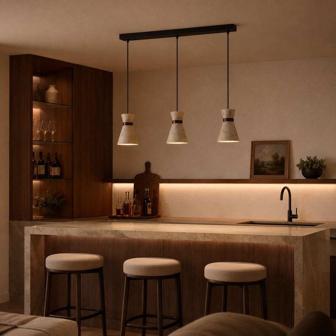 Three head travertine pendant light over a kitchen bar