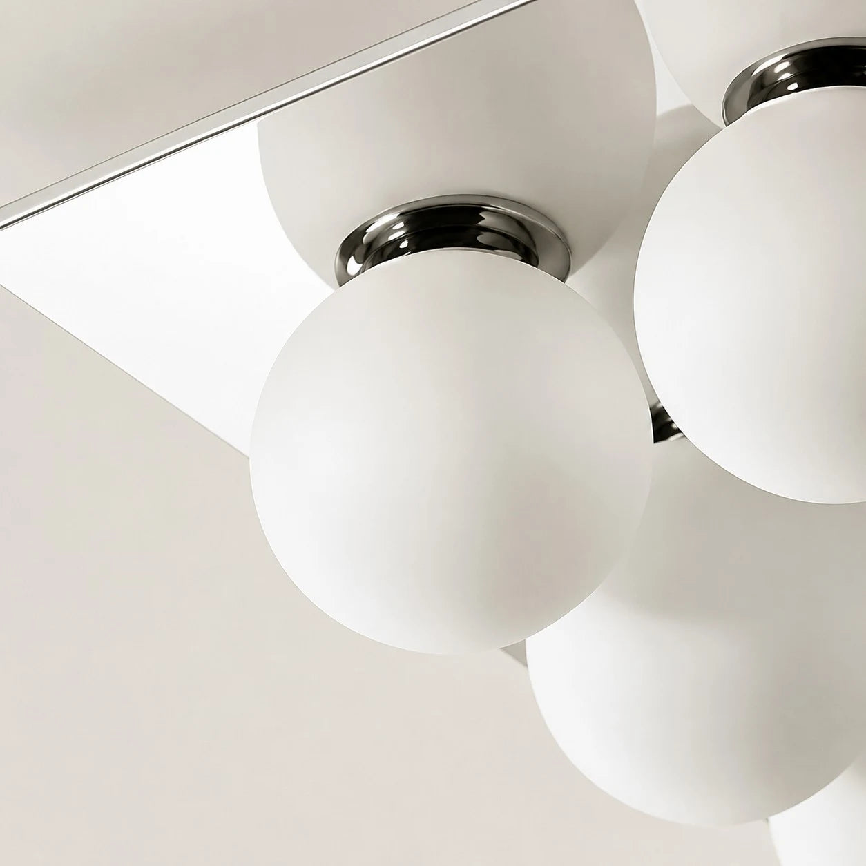 Detail image: close view of chrome fitting and glass diffuser.