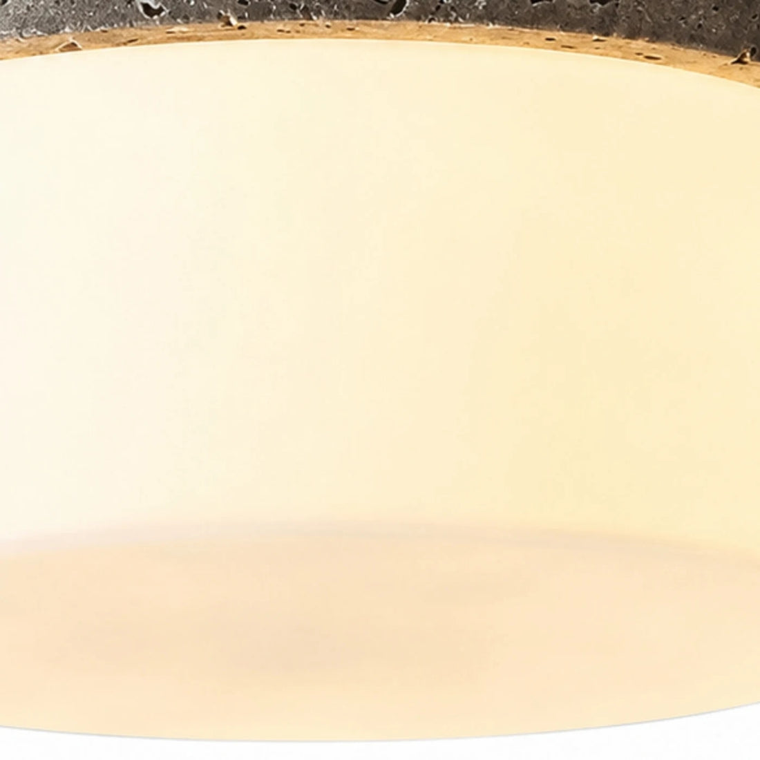 Close detail of warm glass shade and soft diffuser glow
