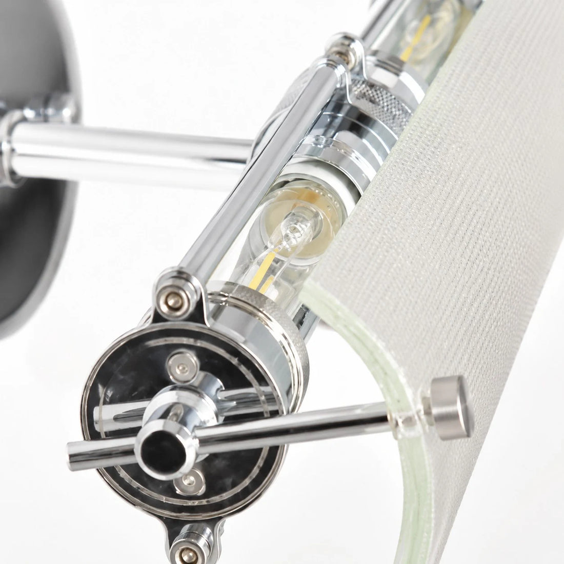 Close detail of the ribbed glass shade and metal bracket