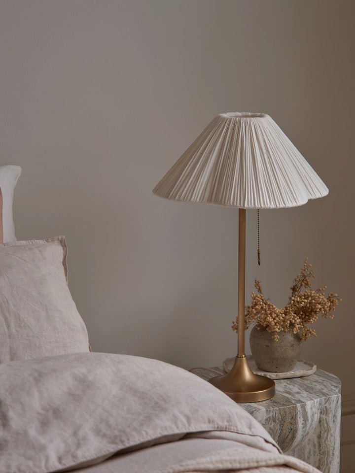 Lindi - aged brass and scalloped linen table lamp