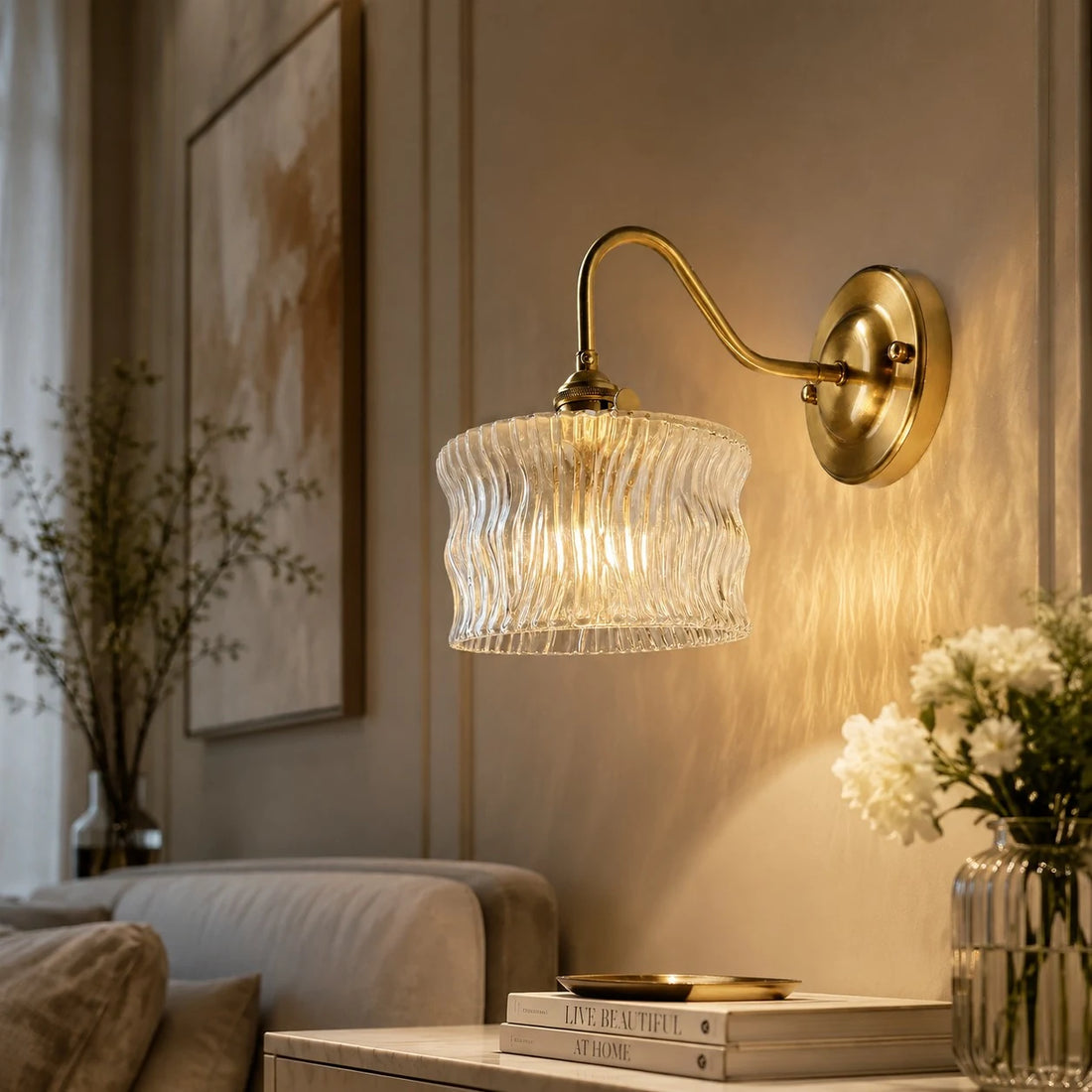 Clear ripple glass wall sconce above a small dresser