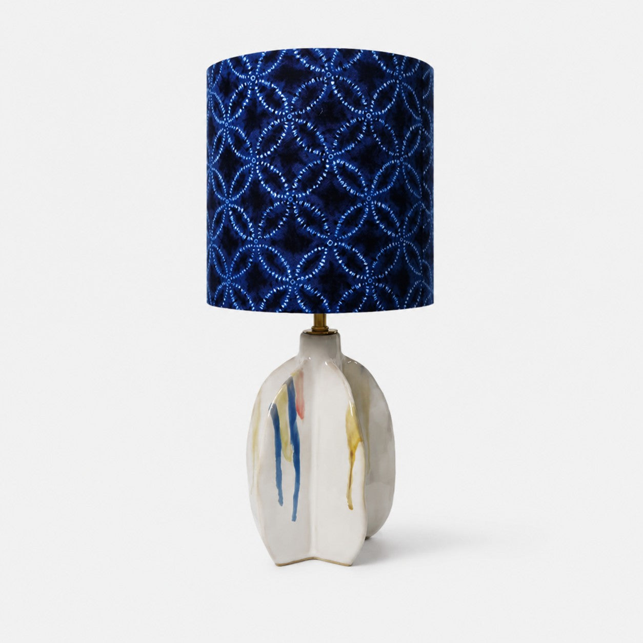 Handmade ceramic table lamp with blue patterned fabric shade
