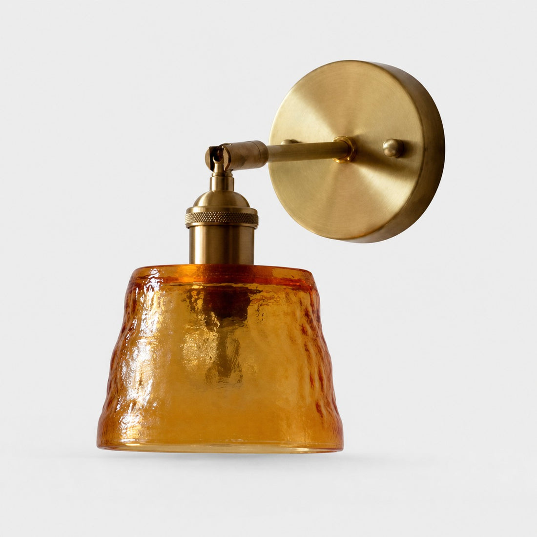 Amber hammered glass brass wall sconce