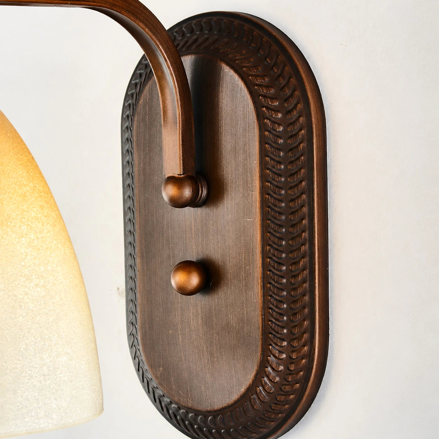 Antique bronze amber glass wall sconce