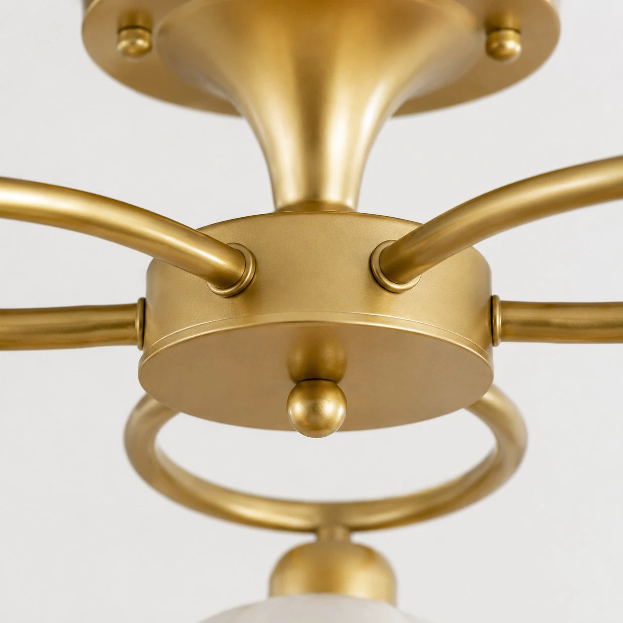Brass center connection and curved arm detail