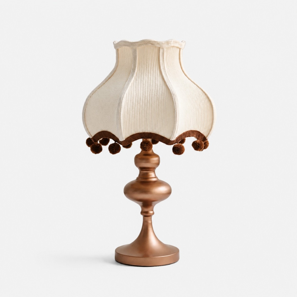 Cream fabric pom-pom table lamp with brown trim
