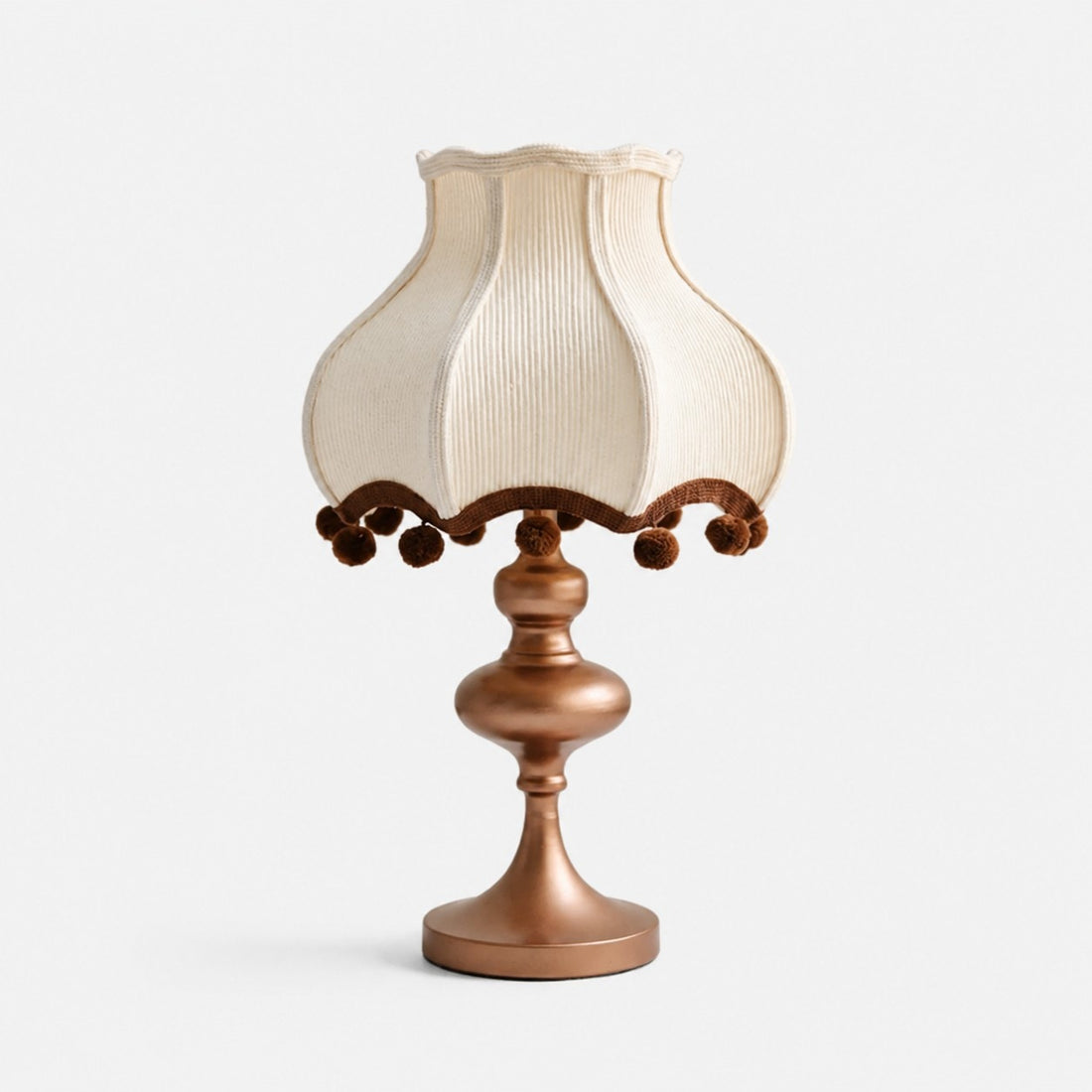 Cream fabric pom-pom table lamp with brown trim