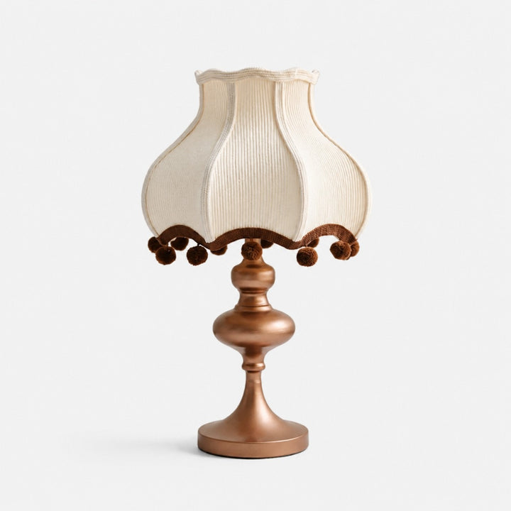 Cream fabric pom-pom table lamp with brown trim
