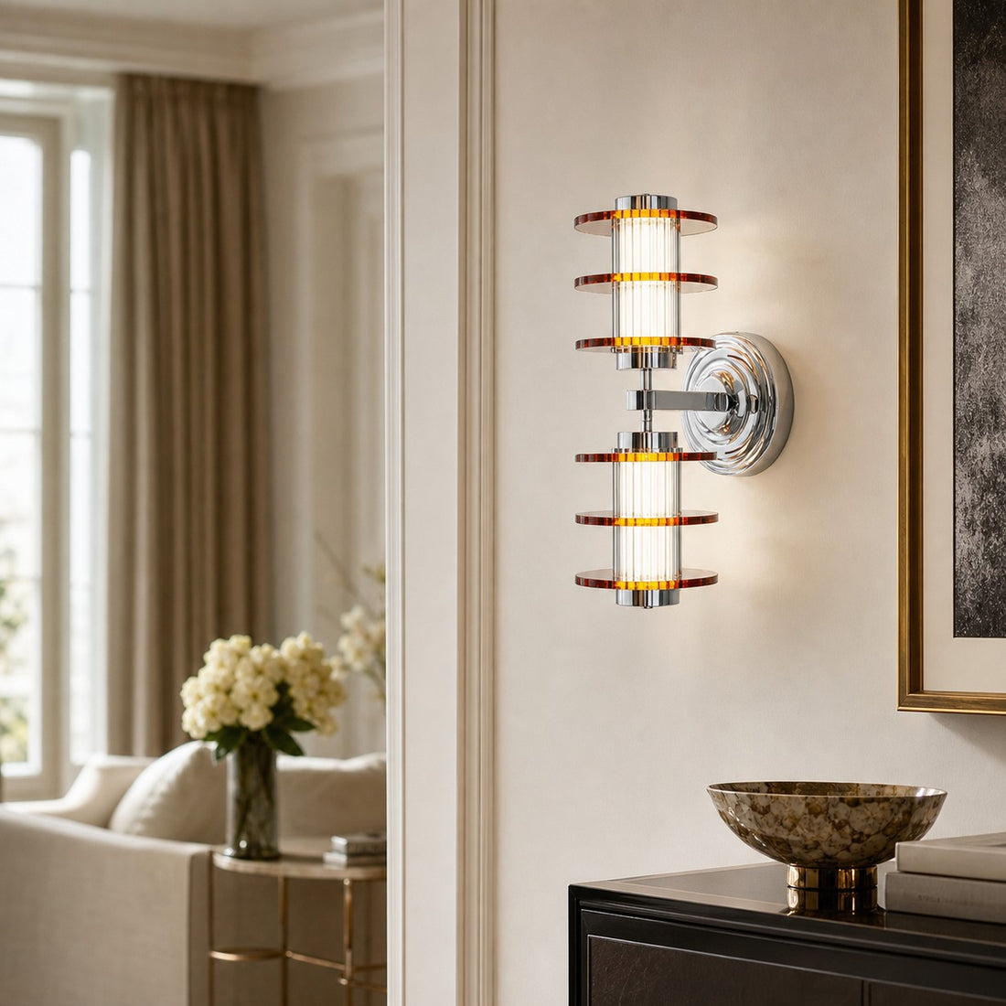 Vertical amber acrylic chrome wall lamp in an entryway setting