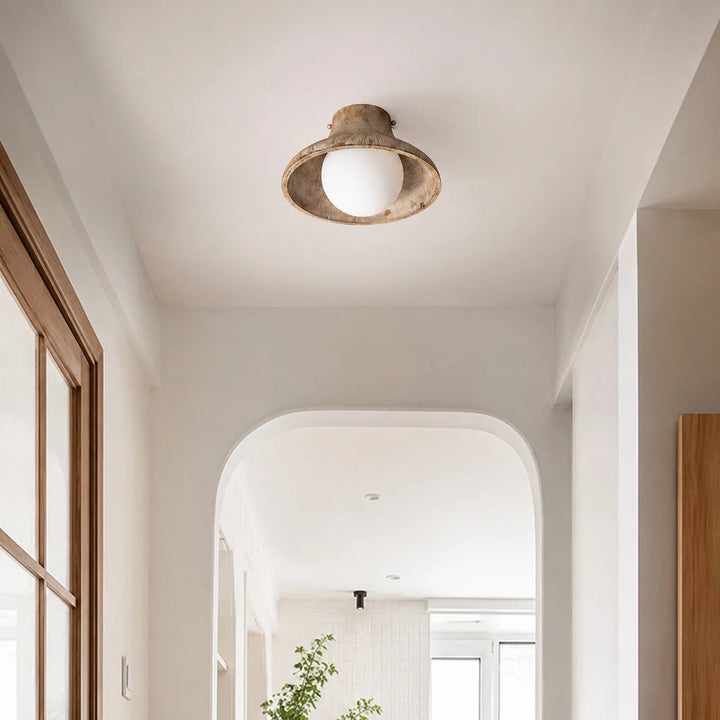 Natural wood ceiling light installed in a hallway