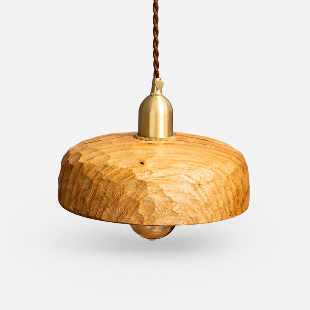 Natural Wood carved pendant lamp on a clean background
