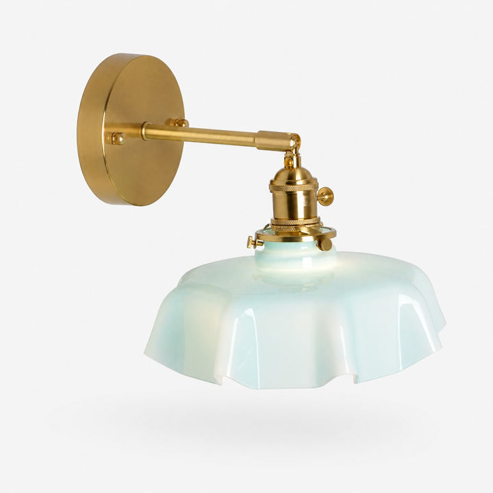 Blue milk glass brass wall sconce on white background