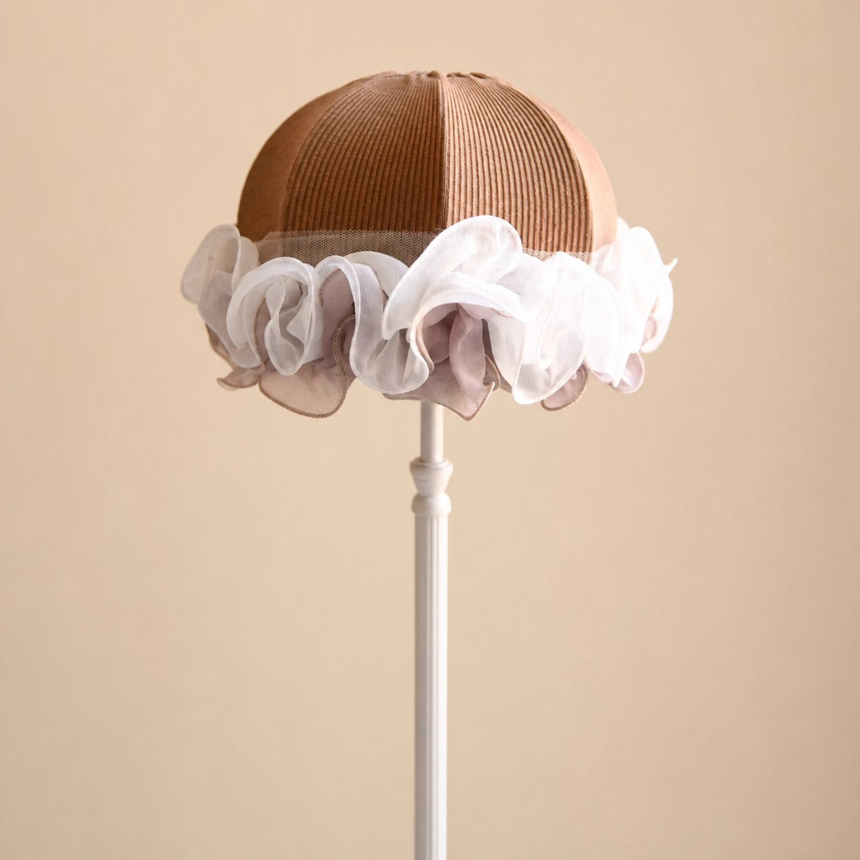 Sheer fabric ruffle and brown cloth lampshade close-up