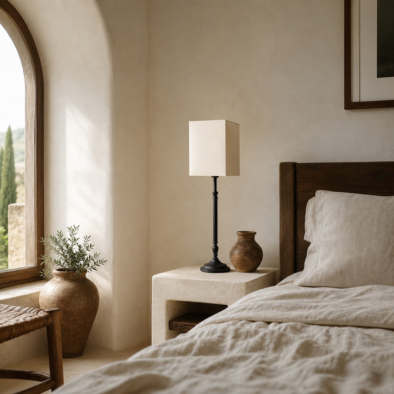 Square fabric shade table lamp in a bedroom