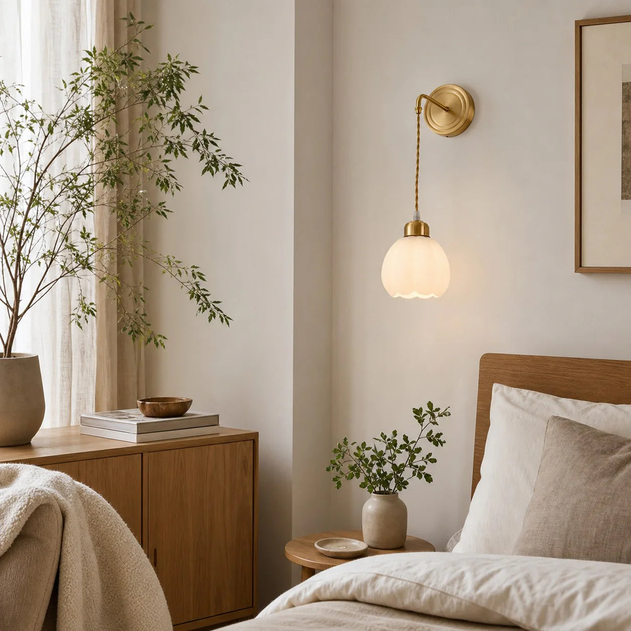 Petal shade wall sconce installed beside a bedroom