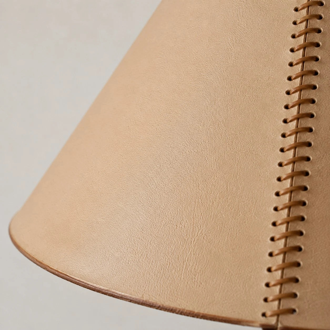 Close detail of stitched leather shade seam