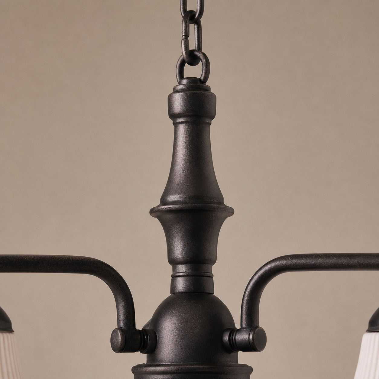Close view of black iron center column and chain