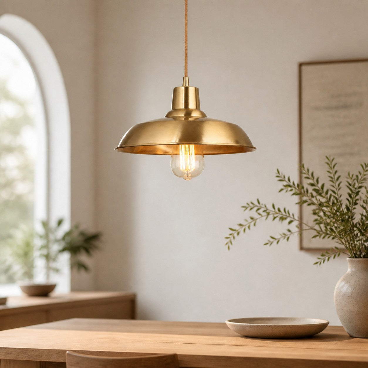 Brass pendant light in a warm interior scene