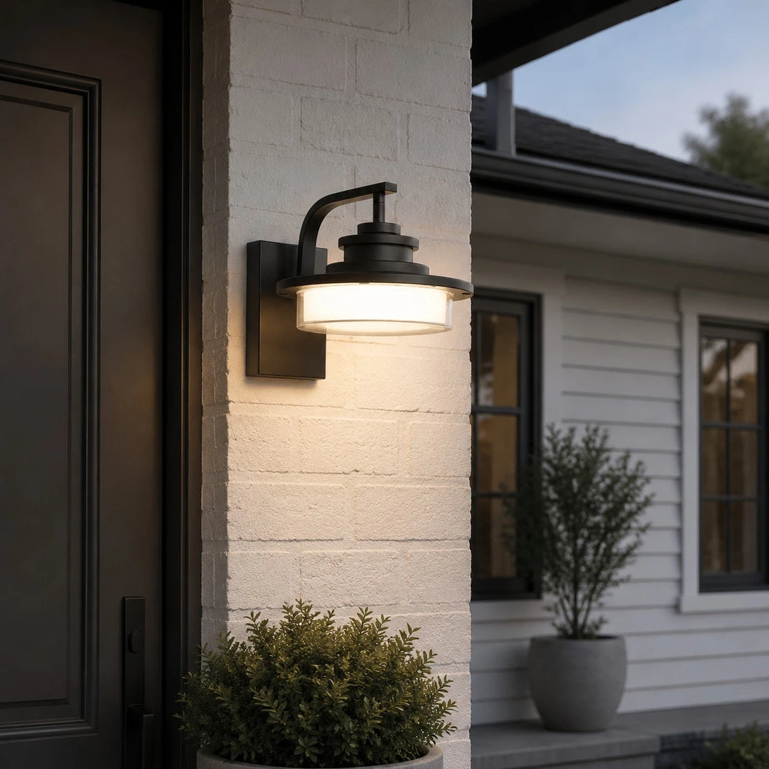 Round outdoor wall light installed at an entry