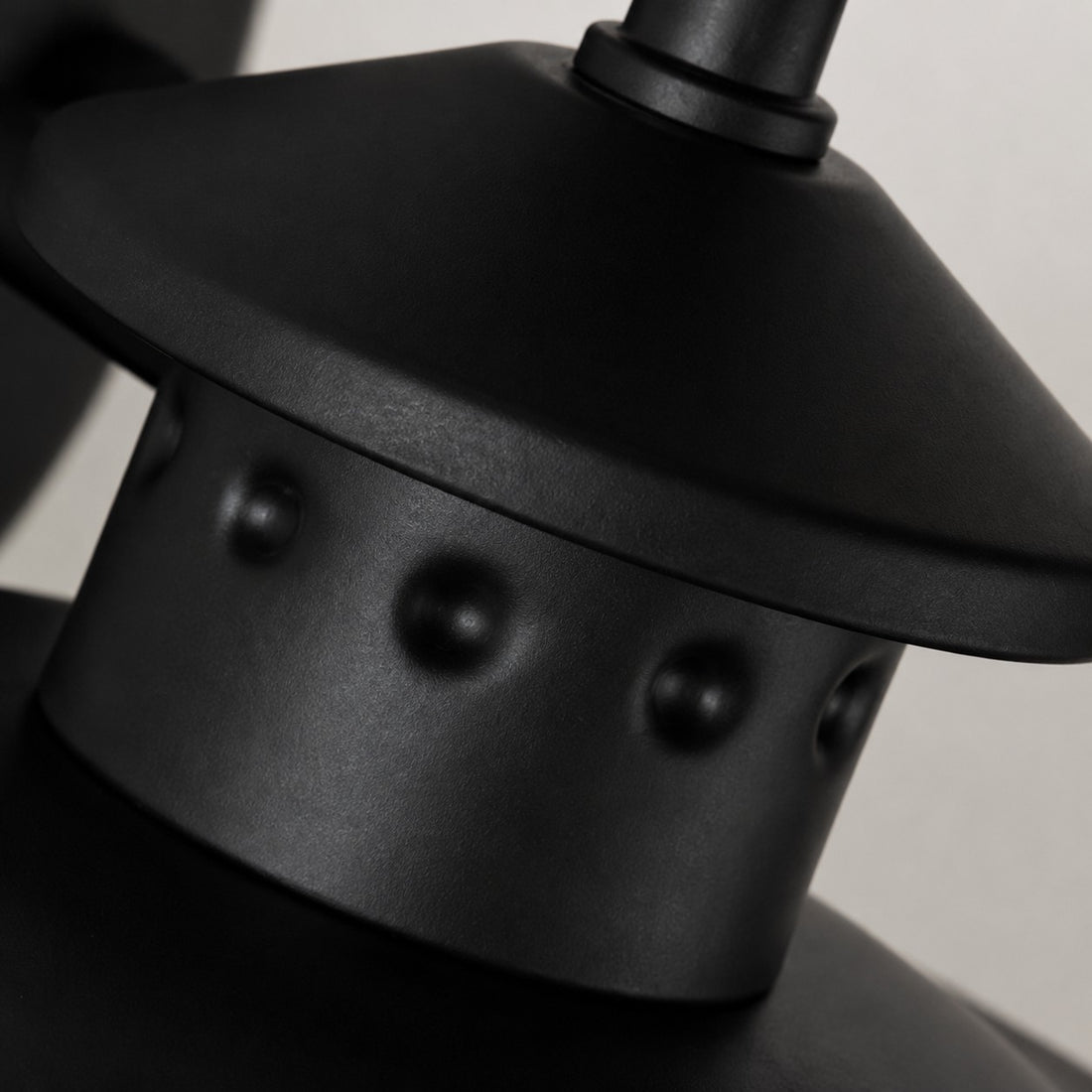 Black riveted metal cap detail
