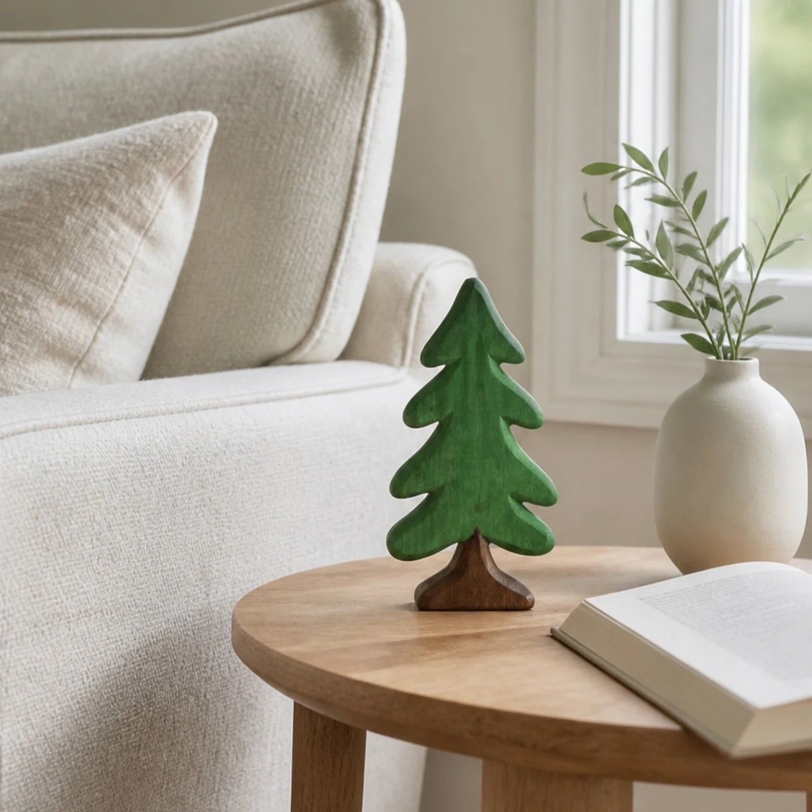 Green pine tree ornament on a coffee table