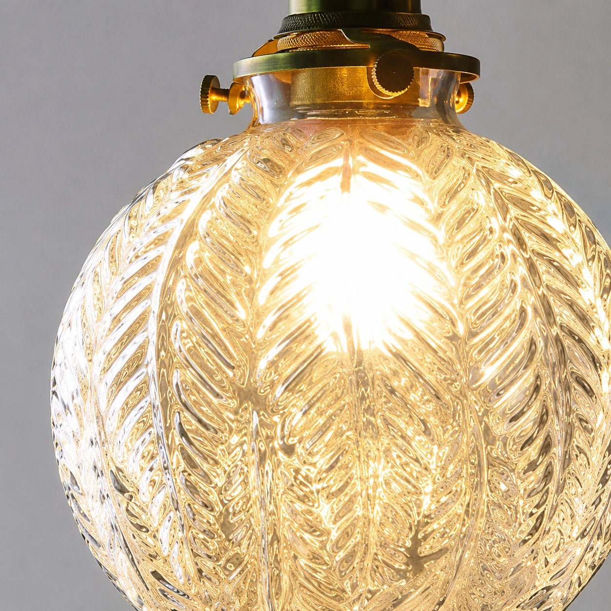 ribbed clear glass pendant shade with warm bulb glow