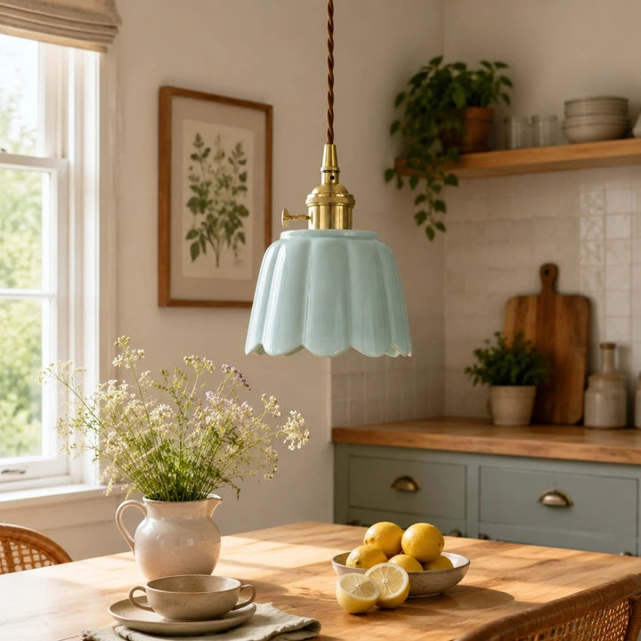 Ceramic lotus pendant installed over a kitchen table