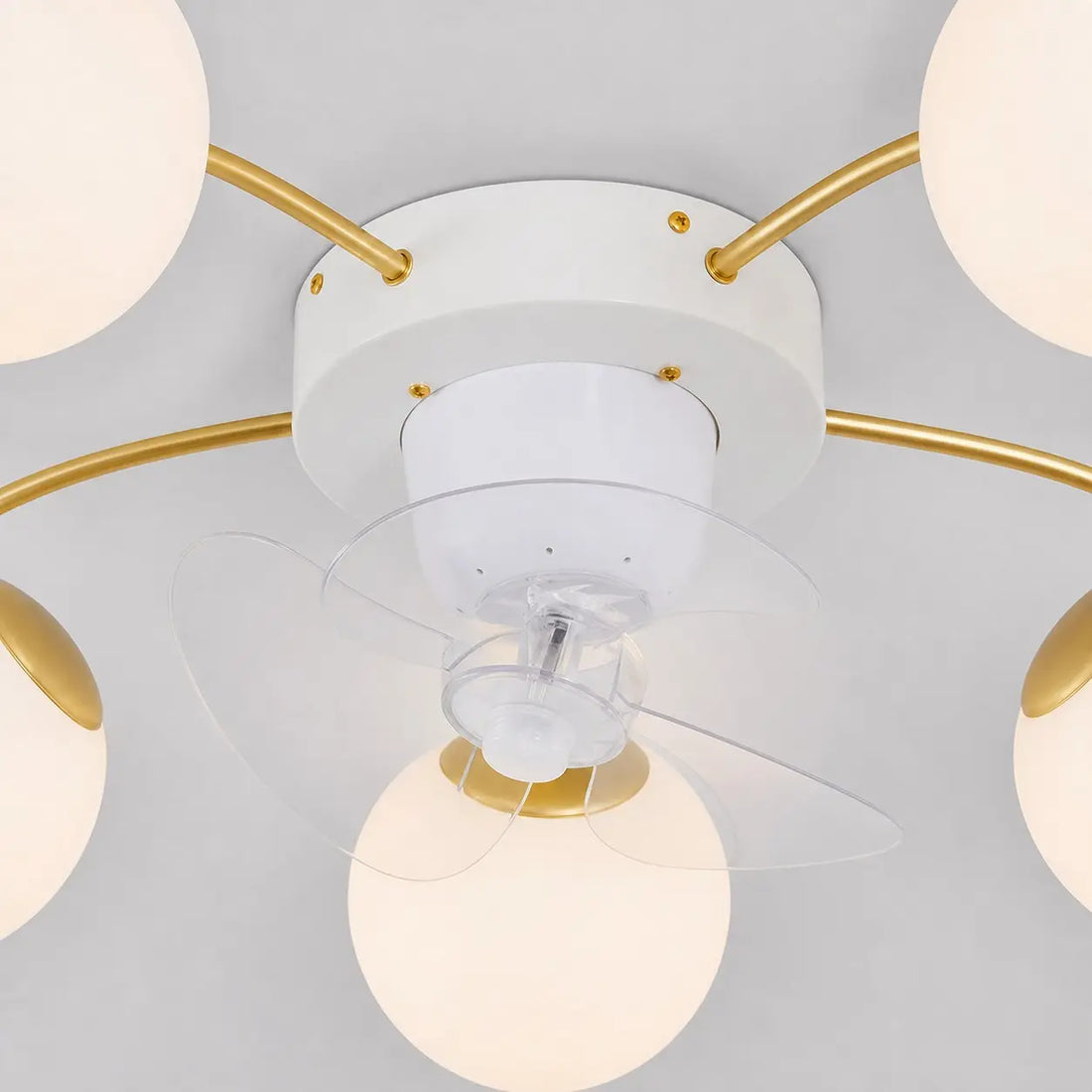 White and gold ceiling fan light in a modern interior