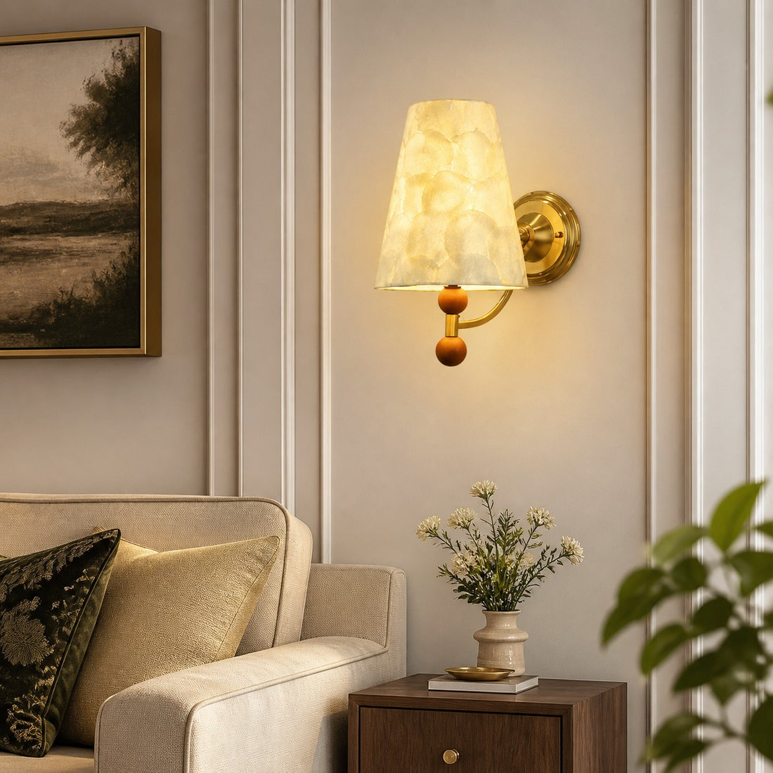 Capiz shell wall sconce illuminating a classic living room wall