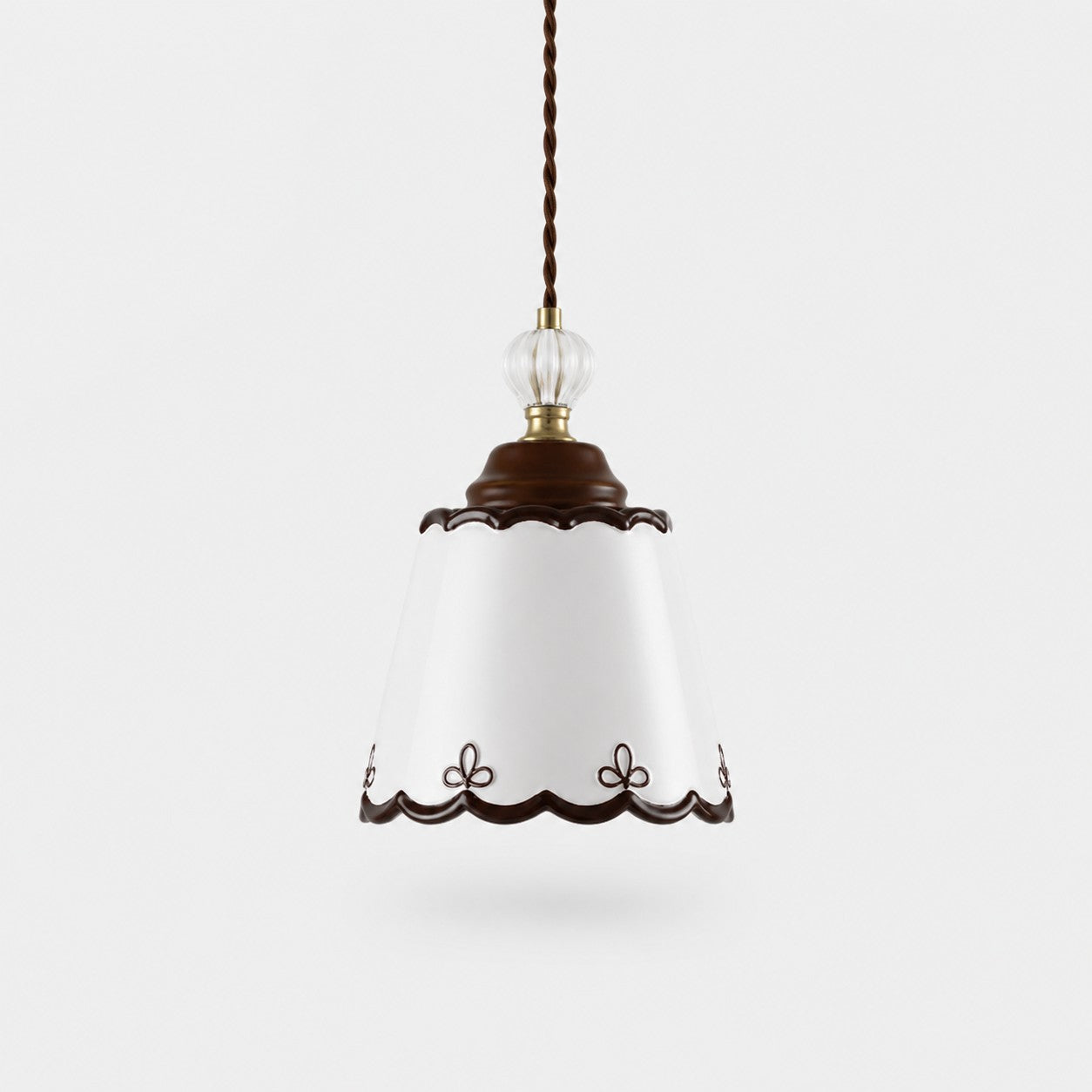 single hand-painted ceramic pendant light on a white background