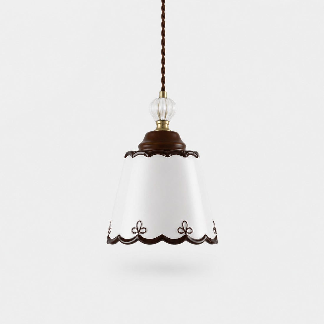 single hand-painted ceramic pendant light on a white background