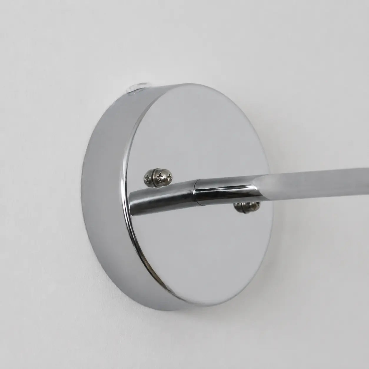 Wall plate and arm connection detail