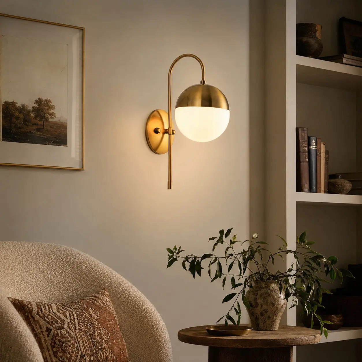 Gold milk glass wall lamp in a modern living room