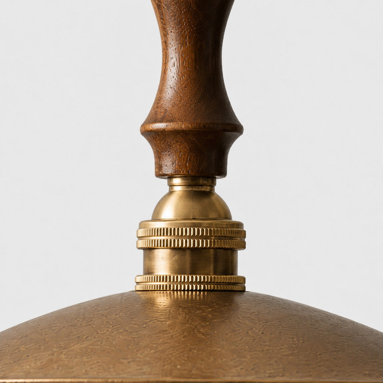 Close view of walnut wood and brass detail
