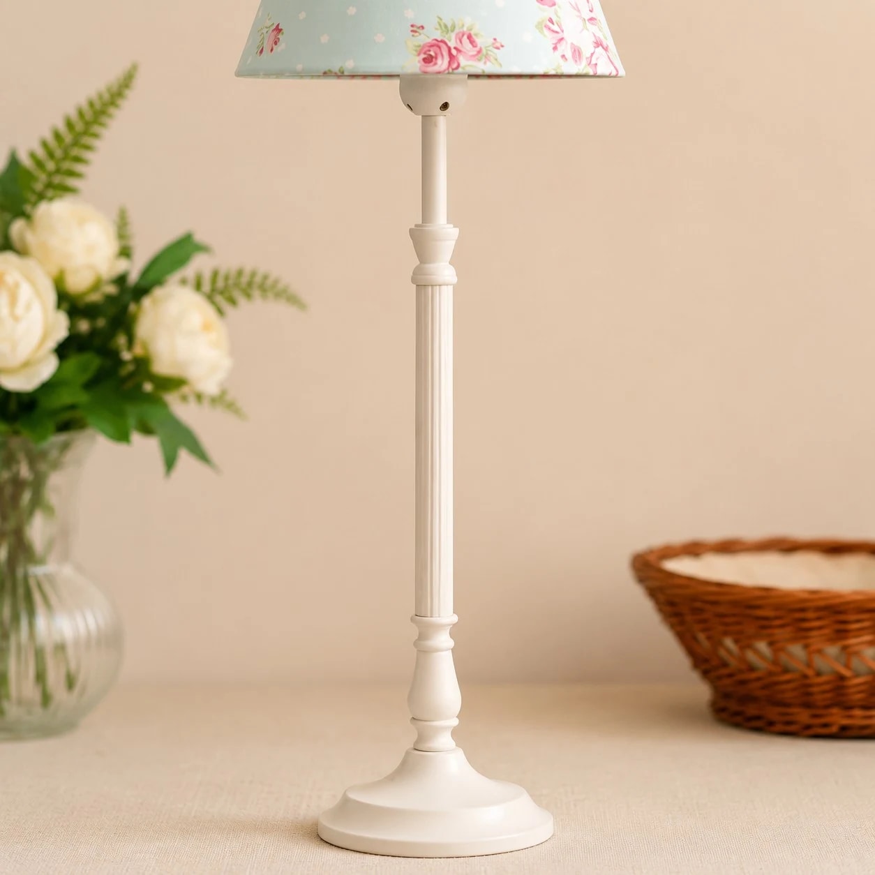 White metal lamp stem and fabric shade detail