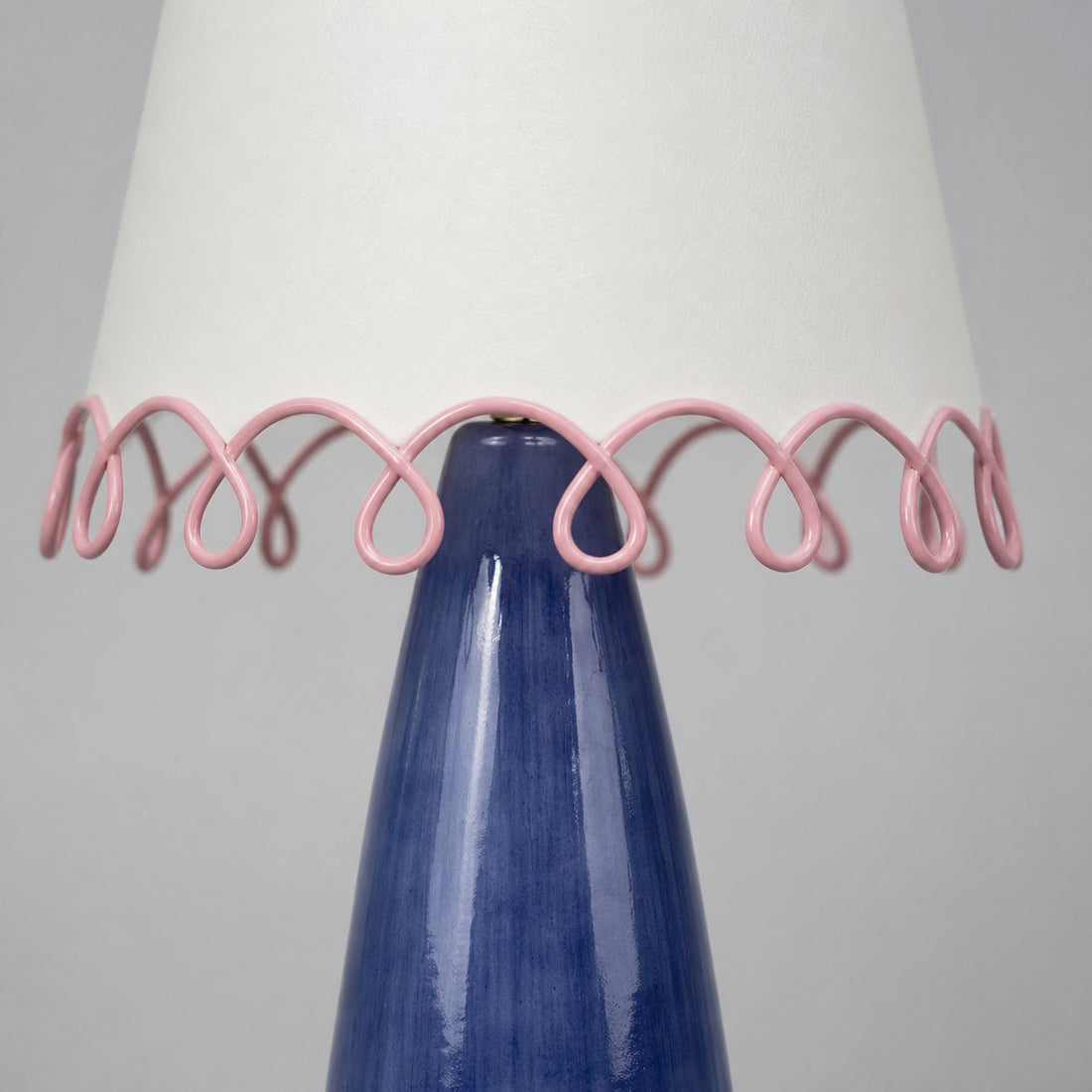 Close view of sculptural pink looped trim