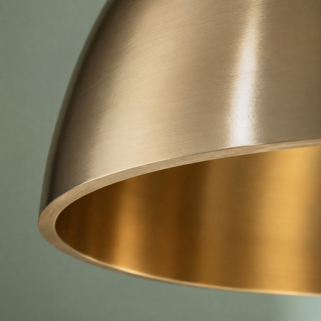 Warm inner brass finish on dome pendant shade