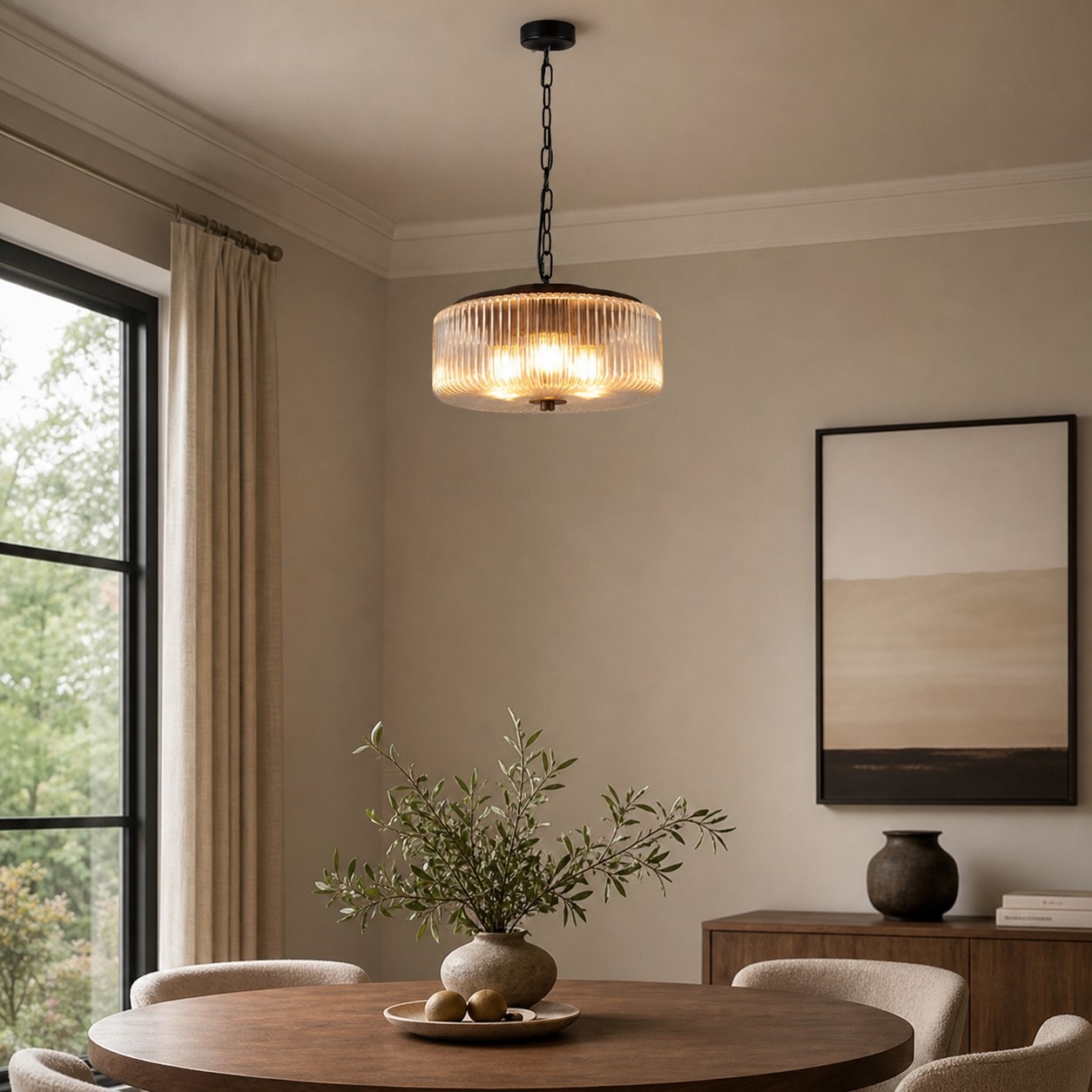 Black ribbed glass pendant ceiling lamp above a dining table